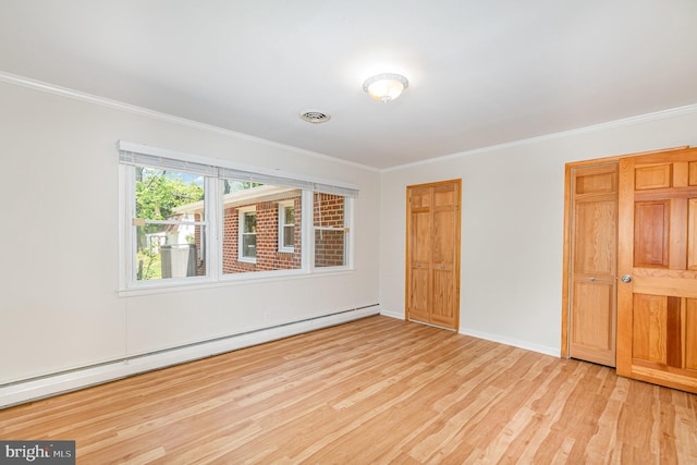 939 Starbit Rd, Towson, MD 21286 - unfurnished bedroom with crown molding, visible vents, baseboards, wood finished floors, and a baseboard heating unit