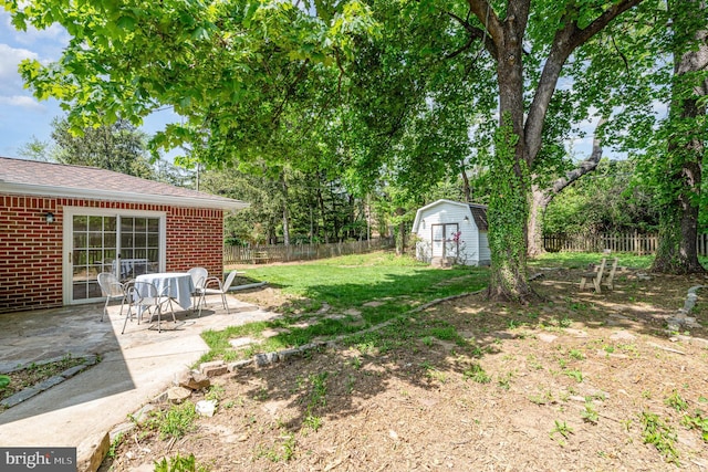 939 Starbit Rd, Towson, MD 21286 - view of yard with a patio, an outbuilding, a fenced backyard, and a shed