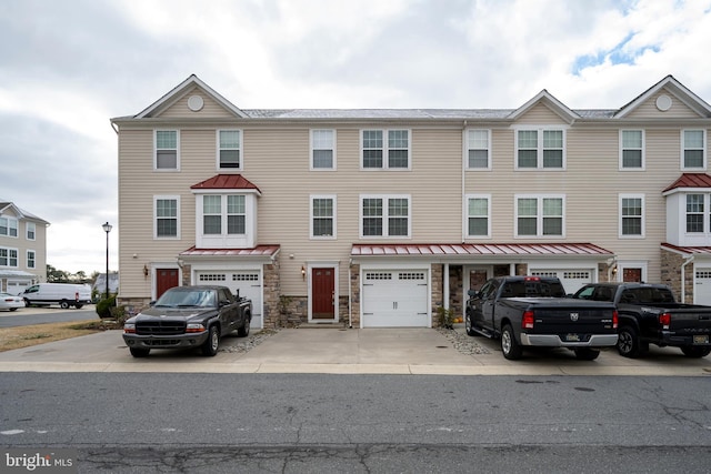 multi unit property featuring a garage