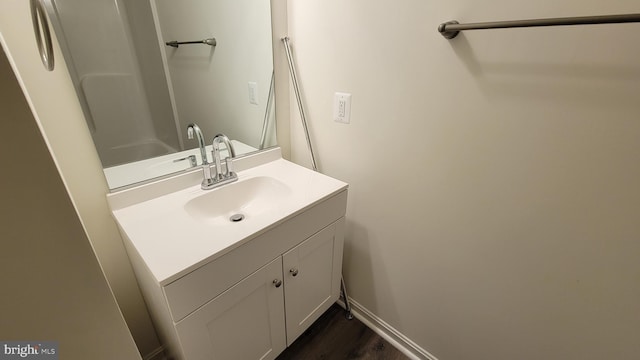 bathroom with vanity and wood-type flooring