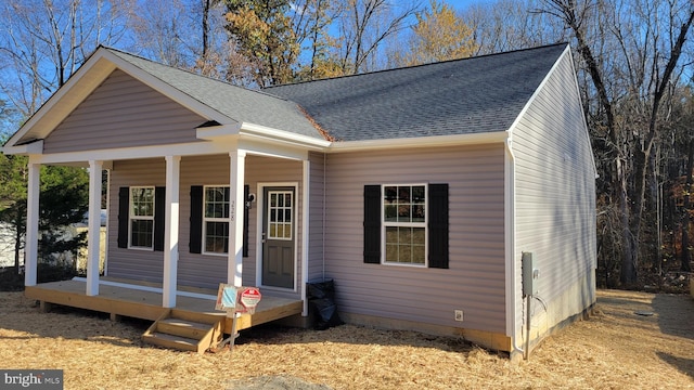 view of front facade featuring a porch and a shingled roof