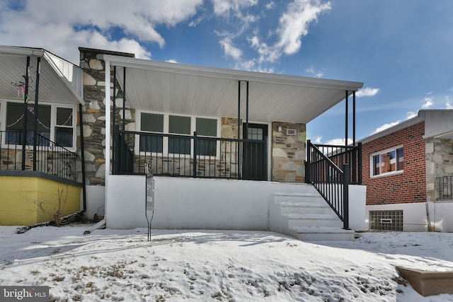 view of front of home with stone siding