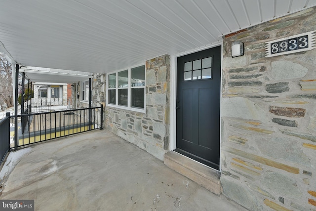 view of exterior entry with stone siding