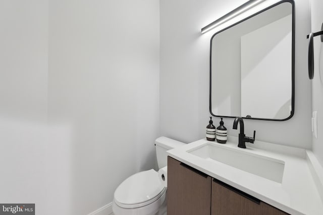 half bath with toilet and vanity