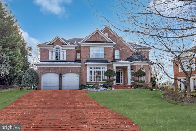 view of front facade featuring a garage and a front yard