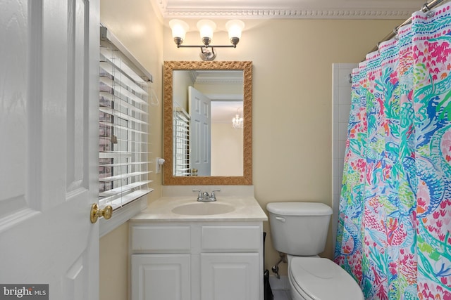 bathroom with ornamental molding, vanity, toilet, and curtained shower