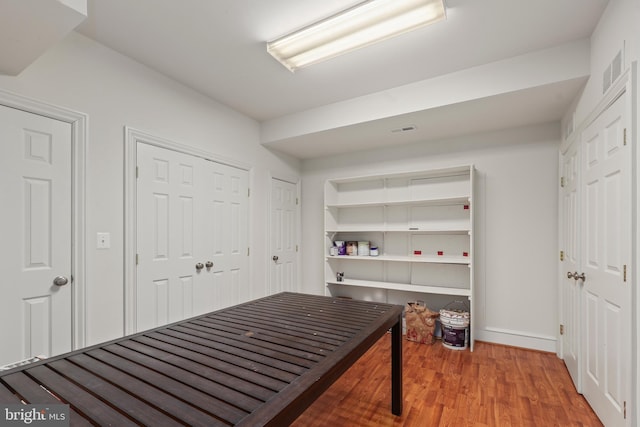 interior space with hardwood / wood-style flooring