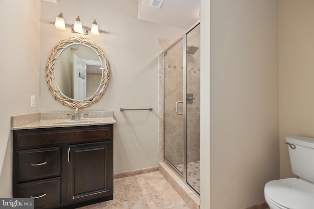 bathroom with walk in shower, vanity, and toilet