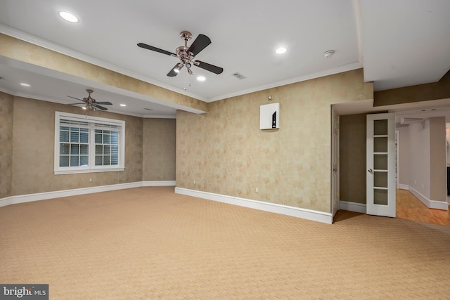 interior space featuring crown molding, ceiling fan, and carpet floors