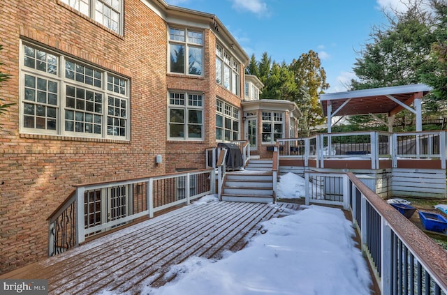 view of snow covered deck