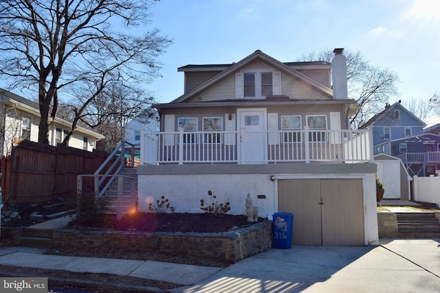 bungalow-style house with a storage shed