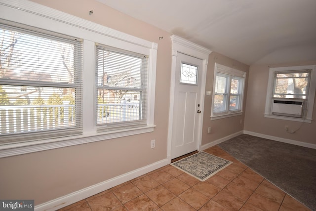 foyer entrance featuring tile patterned flooring, cooling unit, and plenty of natural light