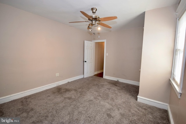 carpeted empty room with ceiling fan