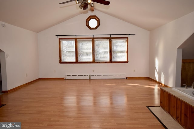 unfurnished living room featuring ceiling fan, vaulted ceiling, light hardwood / wood-style flooring, and a baseboard radiator