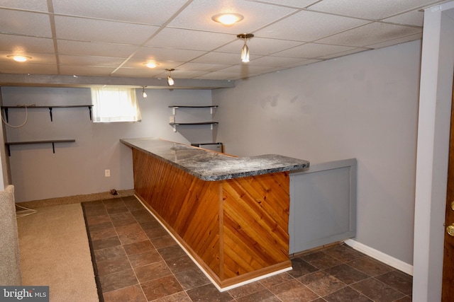 bar featuring a drop ceiling