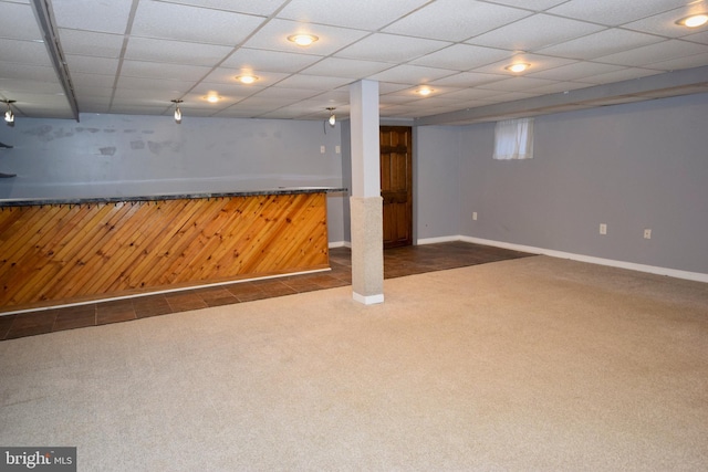 basement with dark carpet