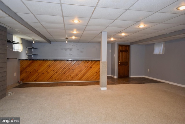 basement with dark colored carpet