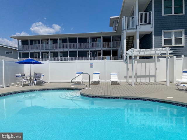 view of swimming pool with a patio