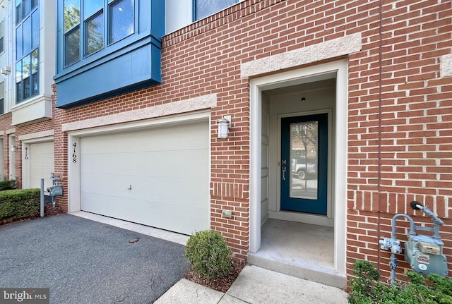 entrance to property featuring a garage