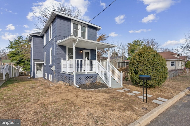 view of front property with a front yard and a porch