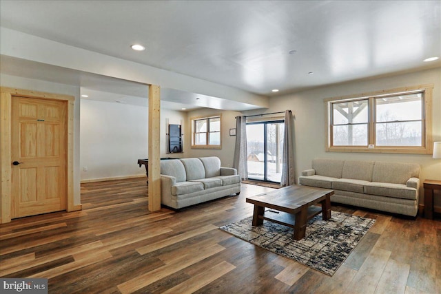 living room featuring dark wood-type flooring