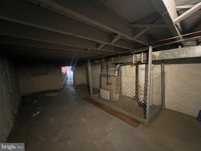 basement featuring heating unit and water heater