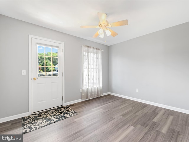 interior space featuring wood-type flooring and ceiling fan