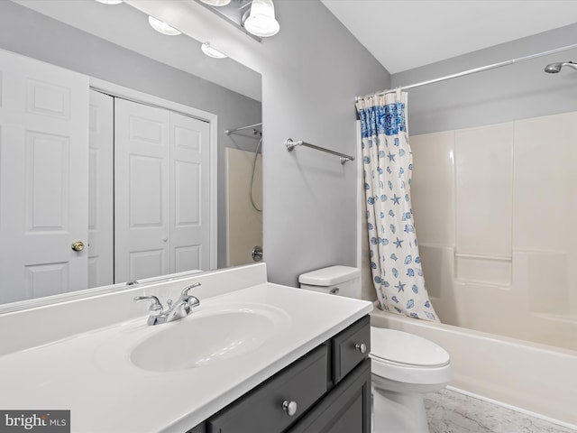 full bathroom with vanity, shower / tub combo, and toilet