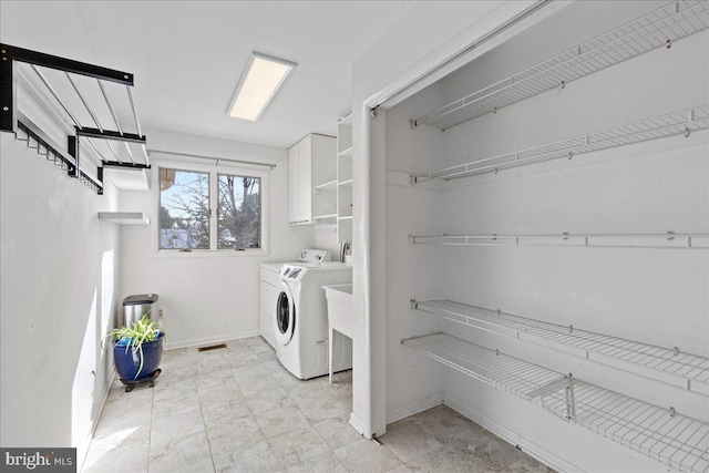 washroom featuring washing machine and dryer