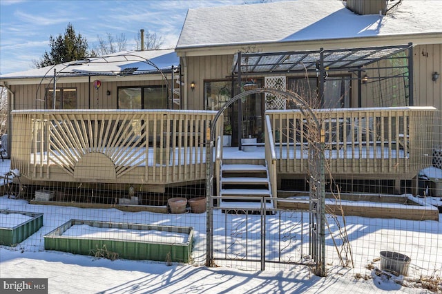 view of snow covered deck