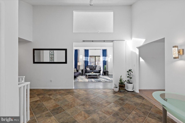 foyer entrance with a high ceiling