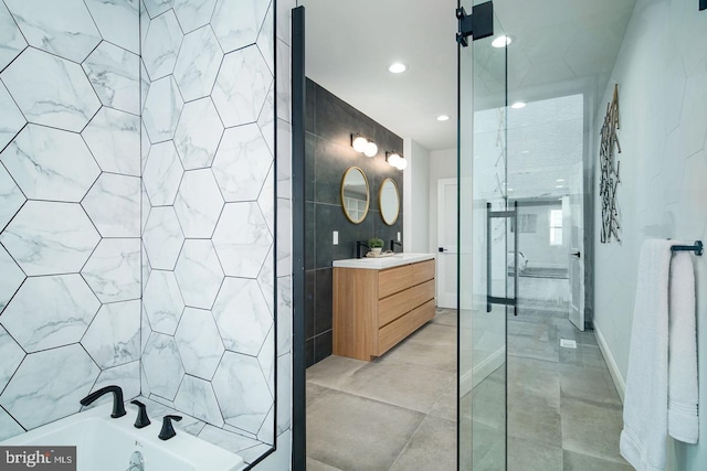 bathroom featuring a bathtub, a shower, tile walls, and vanity