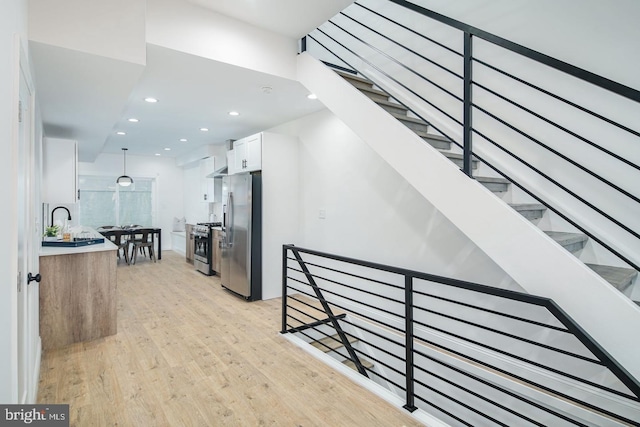 interior space with recessed lighting and wood finished floors