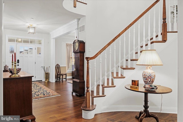 entryway with dark hardwood / wood-style floors