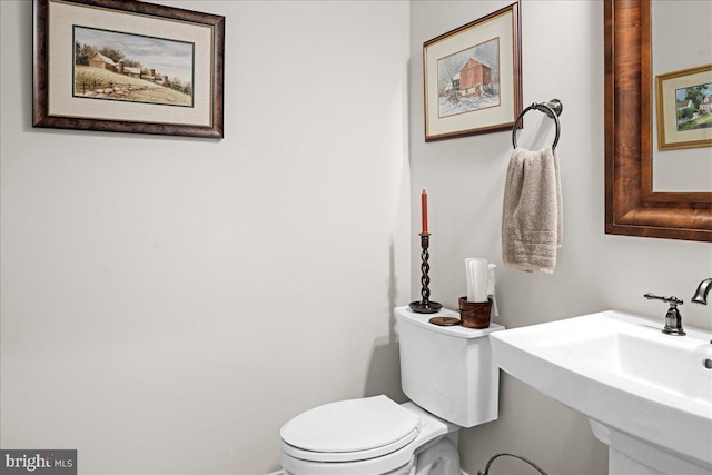 bathroom featuring sink and toilet