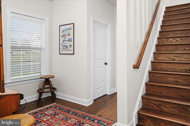 stairs featuring wood-type flooring