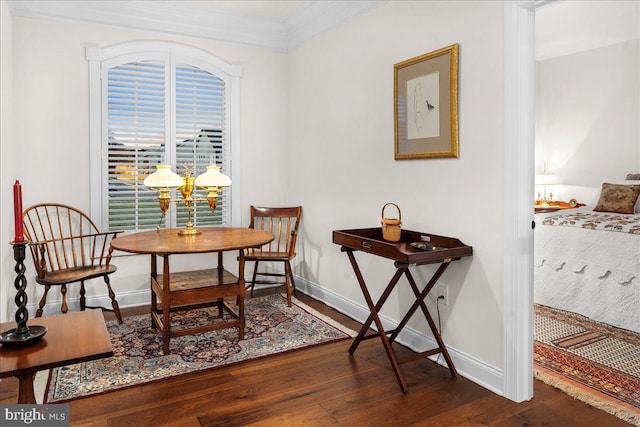 living area featuring crown molding and dark hardwood / wood-style flooring