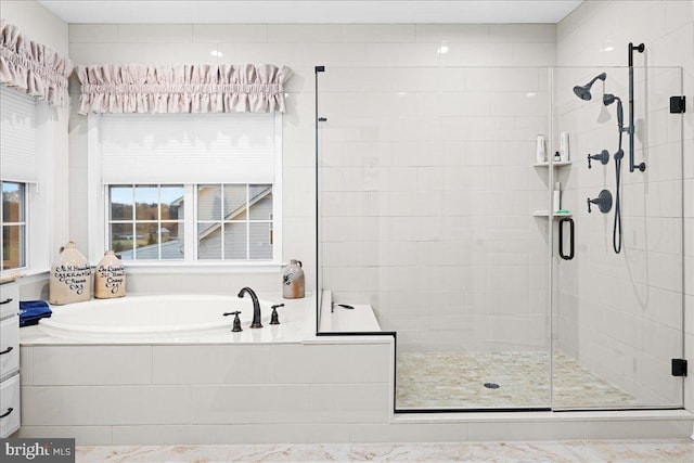 bathroom with shower with separate bathtub