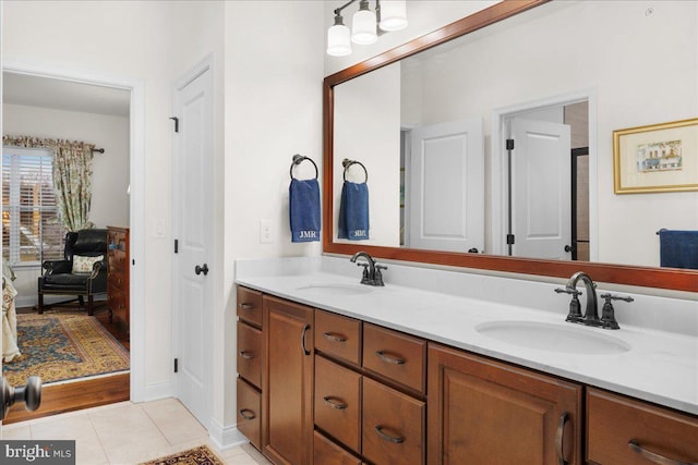 bathroom featuring tile patterned flooring and vanity