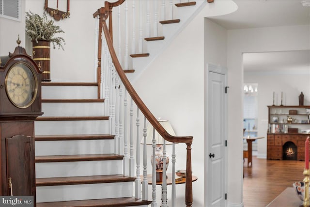 stairs with hardwood / wood-style flooring