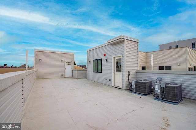 rear view of house with cooling unit