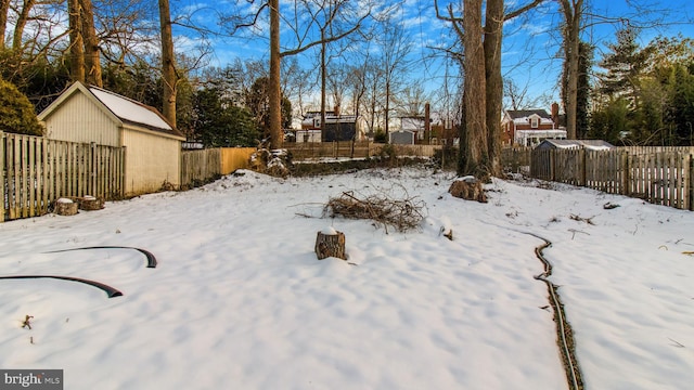 view of yard layered in snow