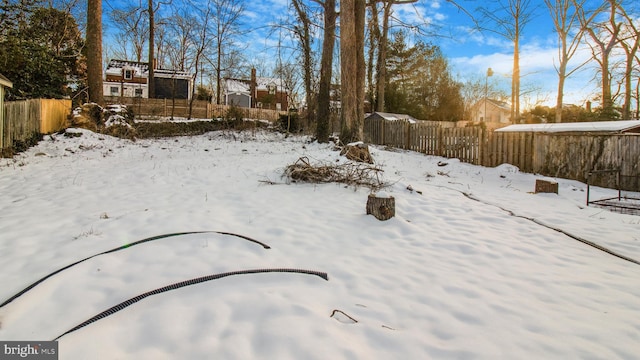 view of yard layered in snow