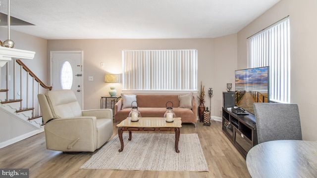 living room featuring a healthy amount of sunlight and light wood-type flooring