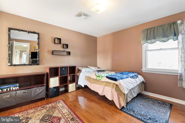 bedroom featuring hardwood / wood-style flooring