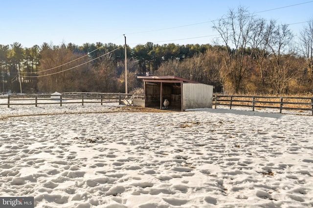 view of yard with an outbuilding and a rural view