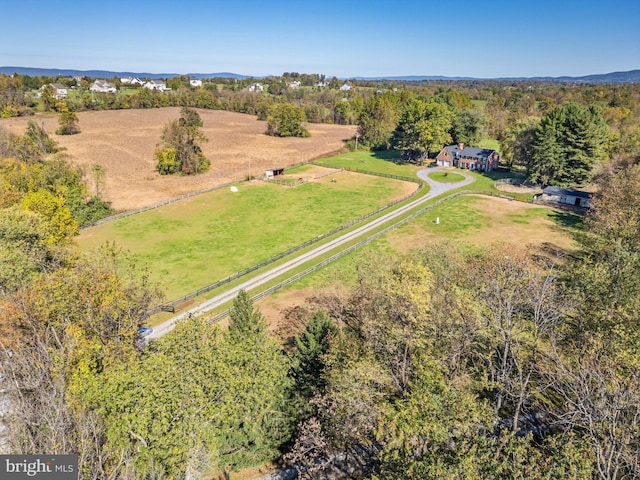 birds eye view of property with a rural view