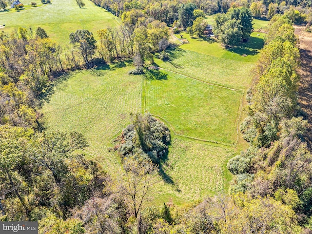 birds eye view of property featuring a rural view