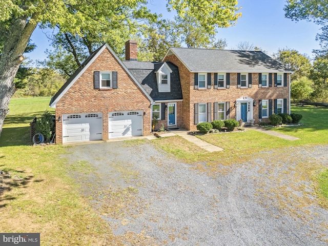 view of front facade featuring a garage and a front lawn