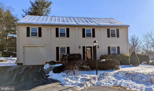 colonial home featuring a garage